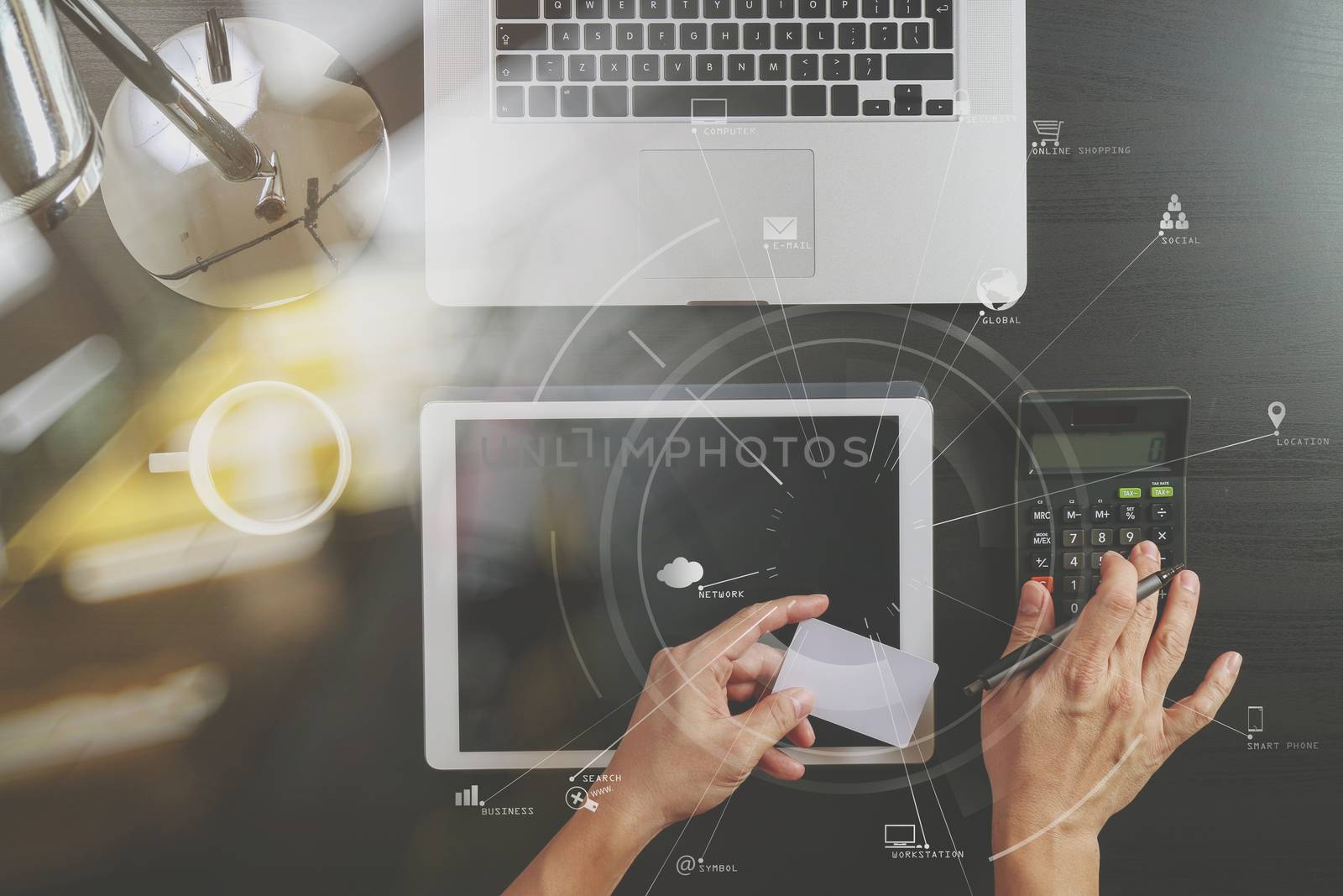 Internet shopping concept.Top view of hands working with calculator and laptop and credit card and tablet computer on dark wooden table background with Vr diagram