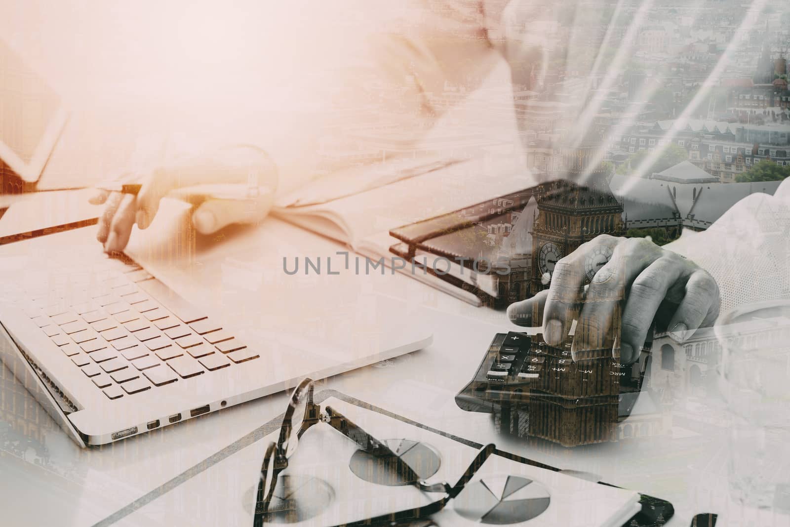 businessman hand working with finances about cost and calculator  and latop with mobile phone on withe desk in modern office with city exposure