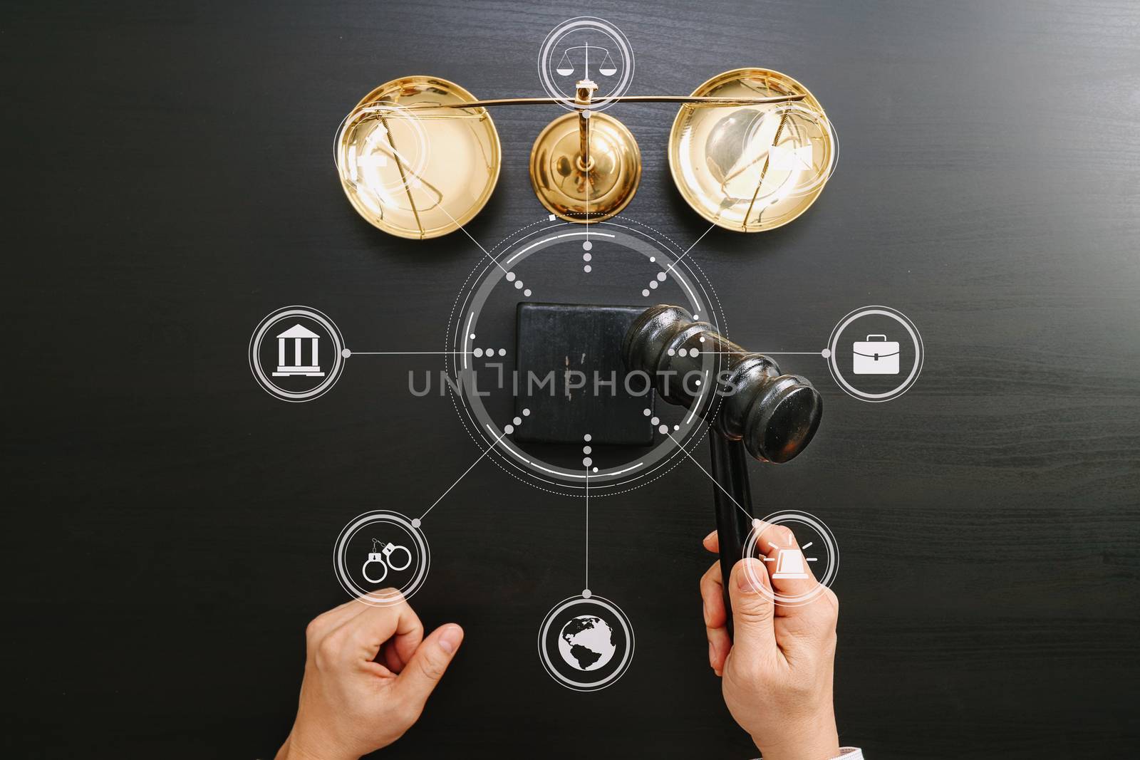 justice and law concept.Top view of Male judge hand in a courtroom with the gavel and brass scale on dark wood table with Vr diagram