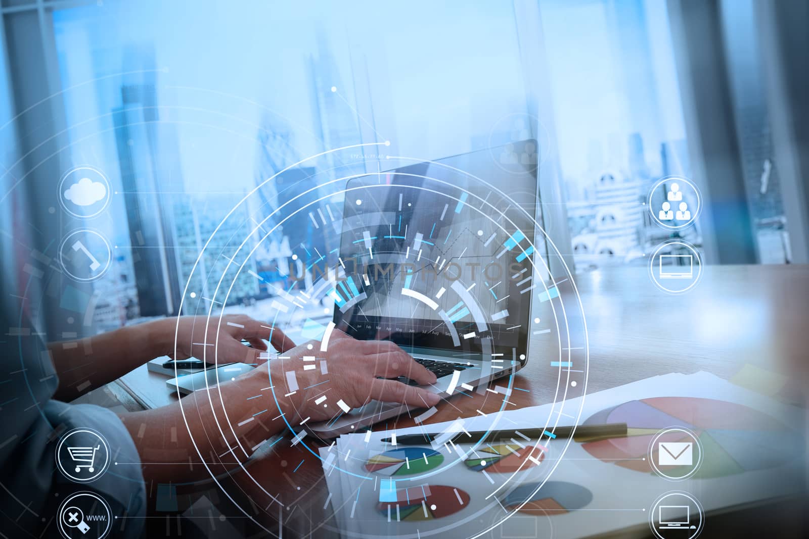 Hands of businessman using mobile phone in modern office with laptop and digital tablet computer in finance team meeting with VR icon diagram