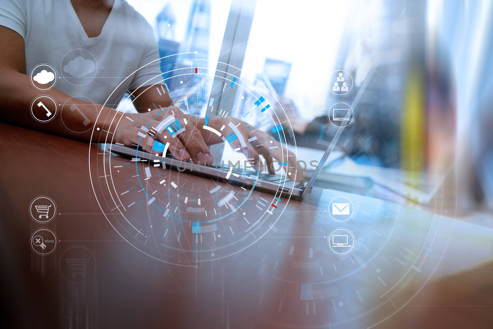 Hands of businessman using mobile phone in modern office with laptop and digital tablet computer in team meeting with VR icon diagram