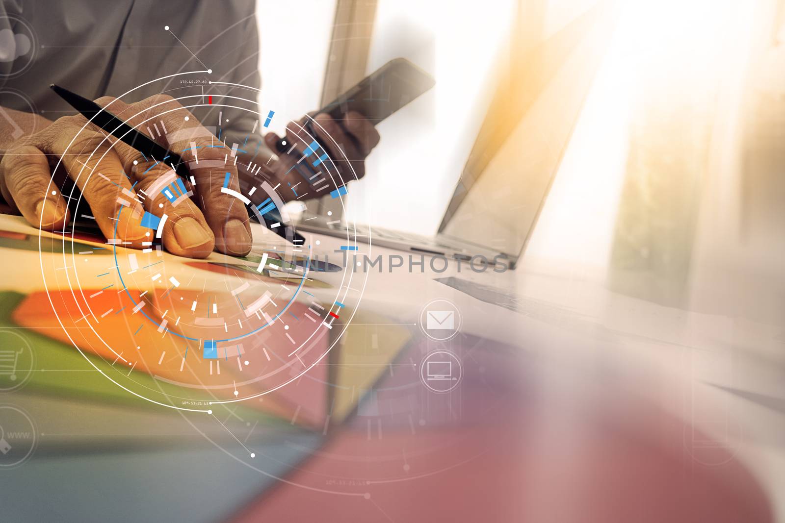 Hands of businessman using mobile phone in modern office with laptop and digital tablet computer in team meeting with VR icon diagram