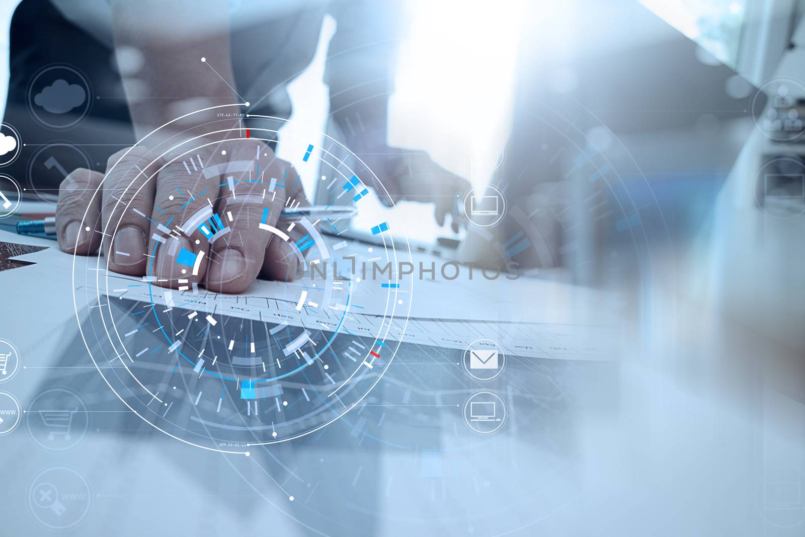 Hands of businessman using mobile phone in modern office with laptop and digital tablet computer in finance team meeting with VR icon diagram