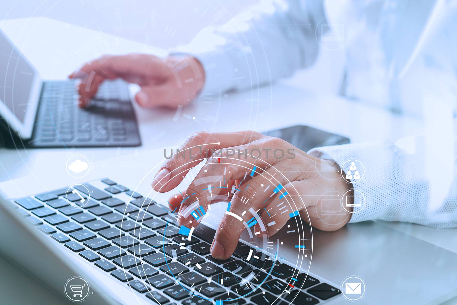 businessman hand working with modern laptop computer in modern office with virtual icon diagram