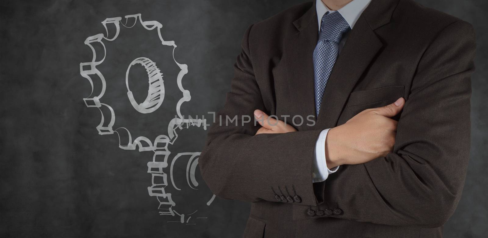 smart businessman with gear to success concept
