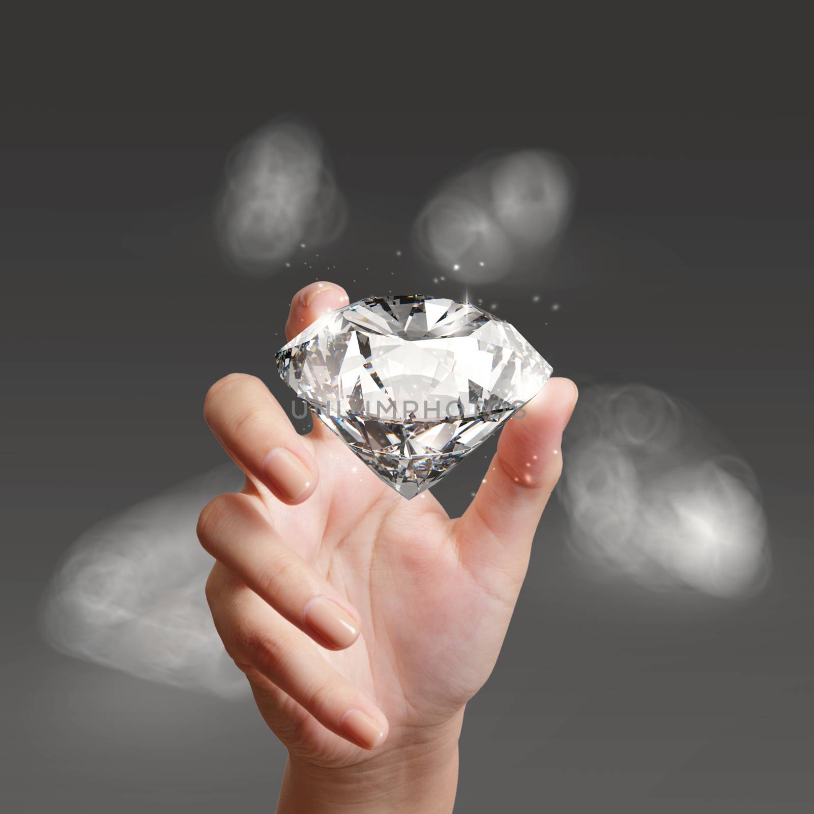 hand holding 3d diamond over grey background by everythingpossible