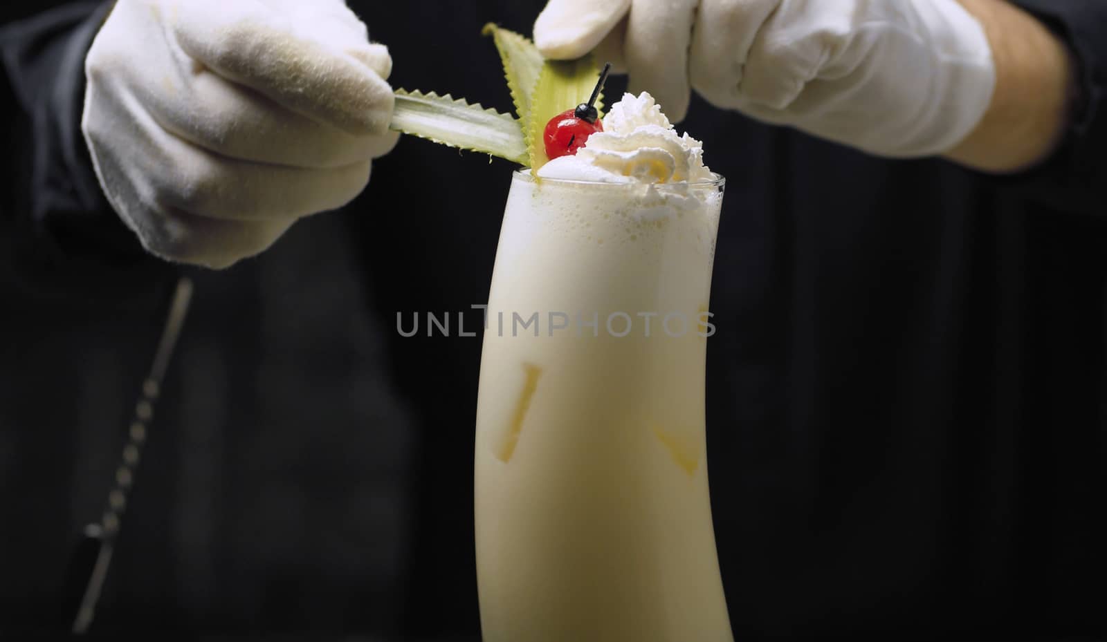 Garnishing Pina Colada Cocktail by Alize