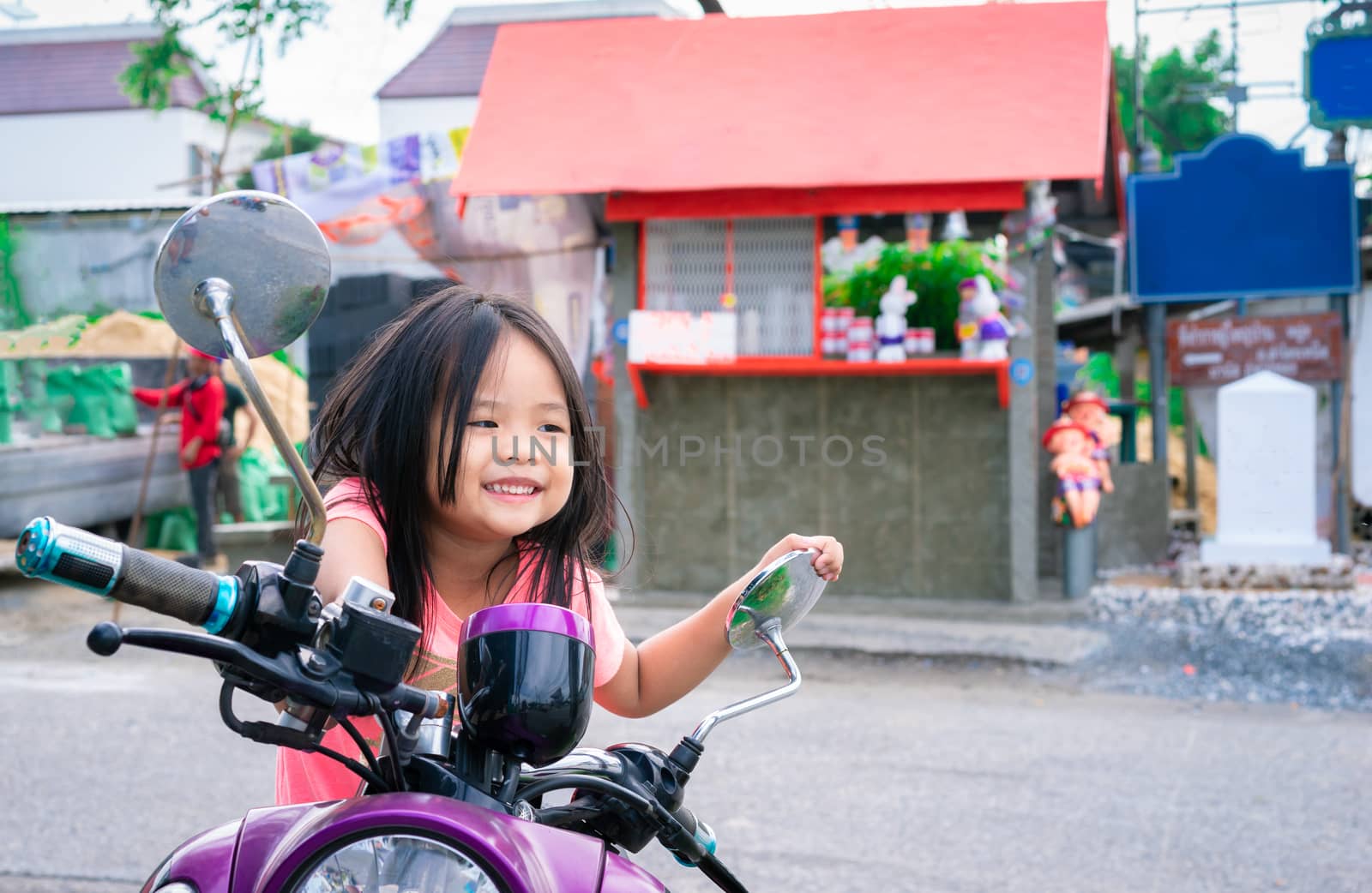 Cute little girl on a motorcycle