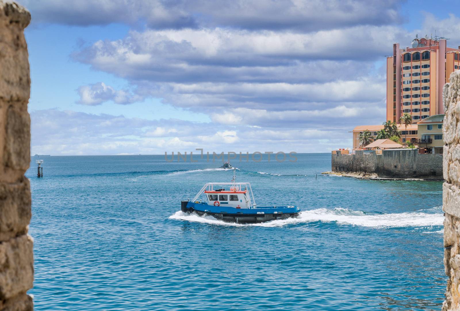 Pilot Boat Through Stone Wall in Curacao by dbvirago