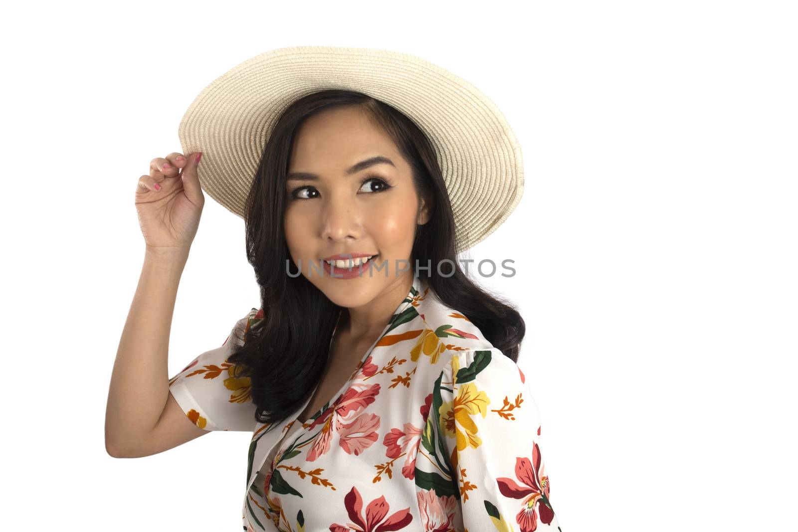 Half shot photo of pretty girl put one hand on white straw hat and looking to left side in studio.