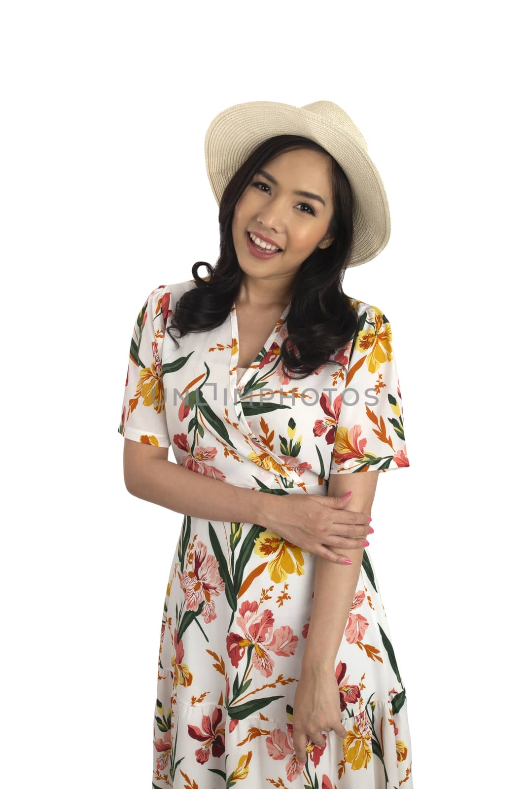 Asian smiling girl in summer casual floral dress and white straw hat on white background.