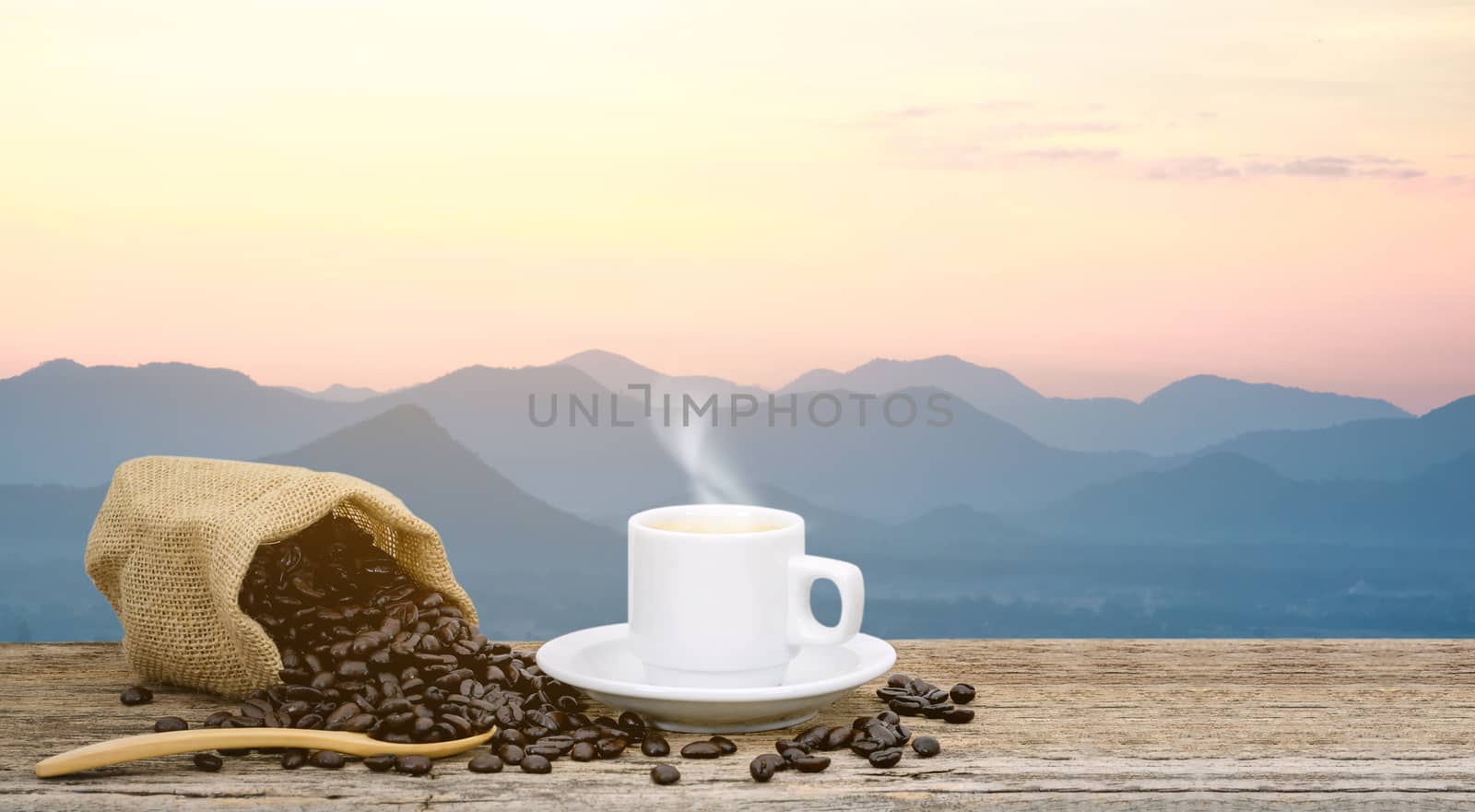 Morning coffee cup and Roasted coffee beans views with mountain sun