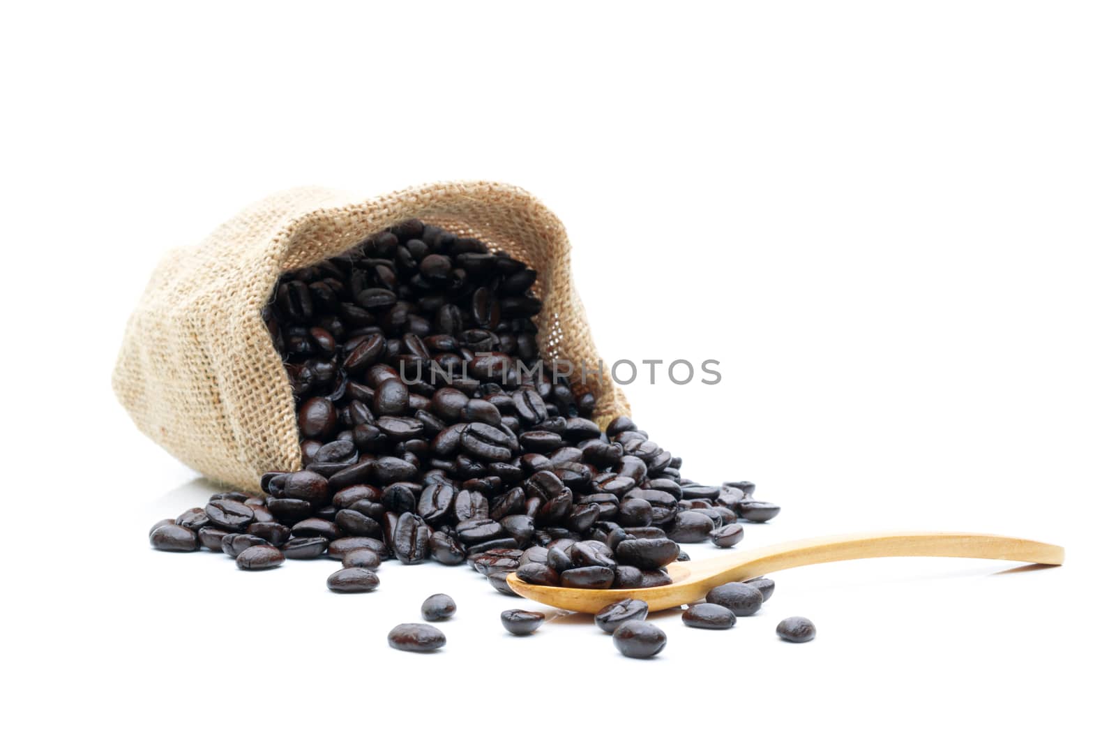 Roasted coffee beans in a sack of cloth on a white background