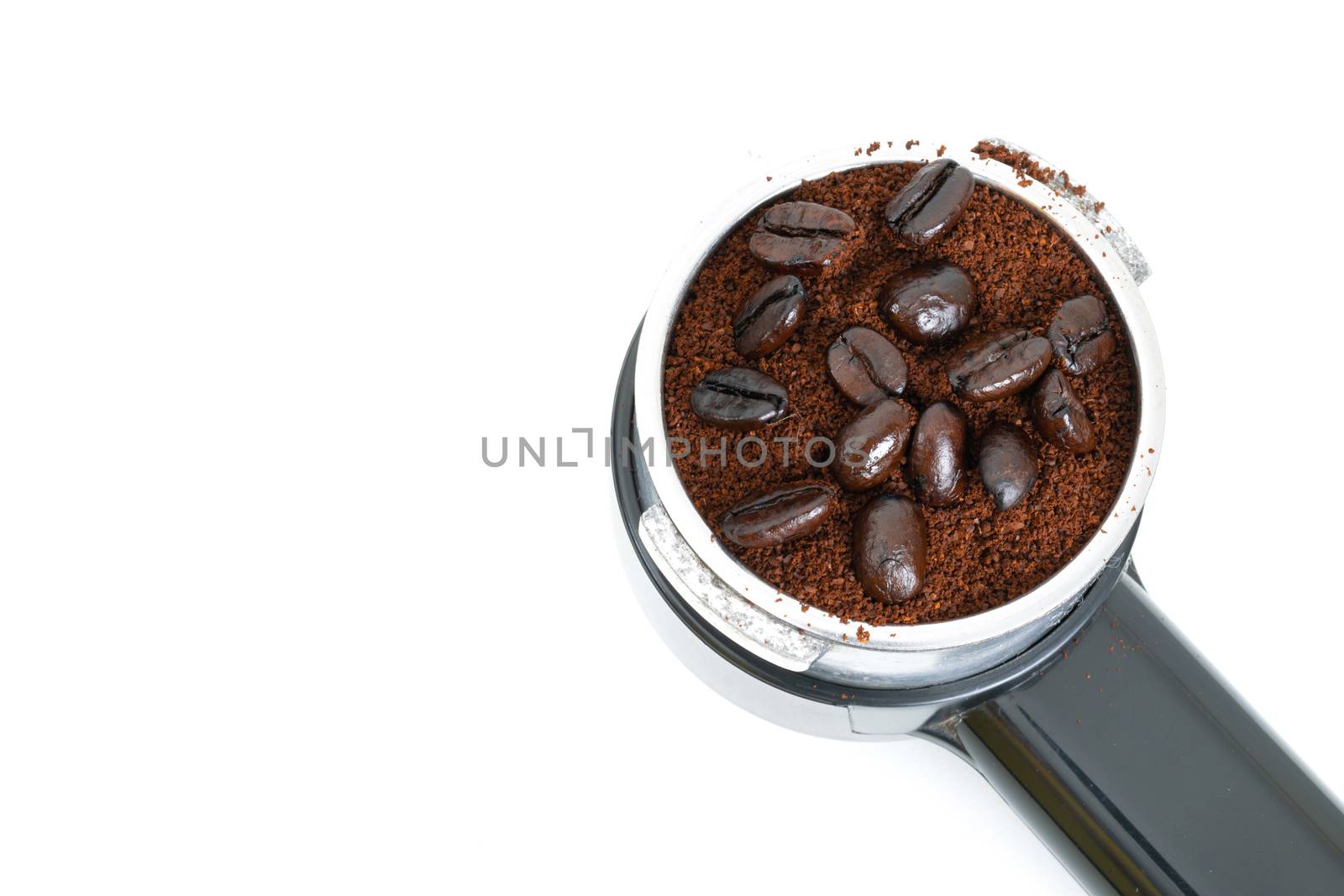 Roasted coffee in the maker on a white background by sompongtom