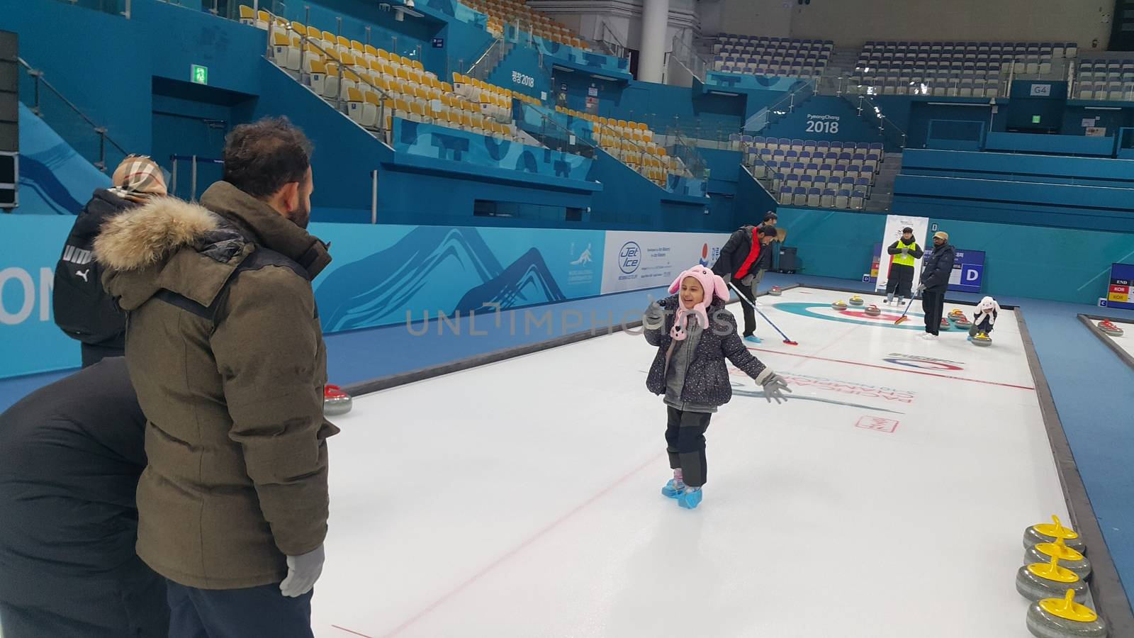 People play in curling for recreation purpose in ice arena during winter season by Photochowk