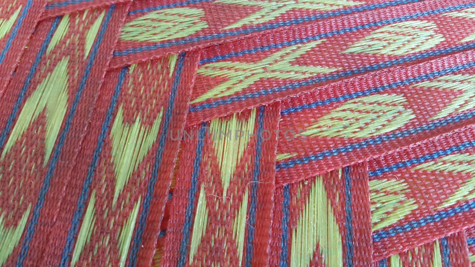 Colorful plastic woven stripes of traditional bed used in rural areas.