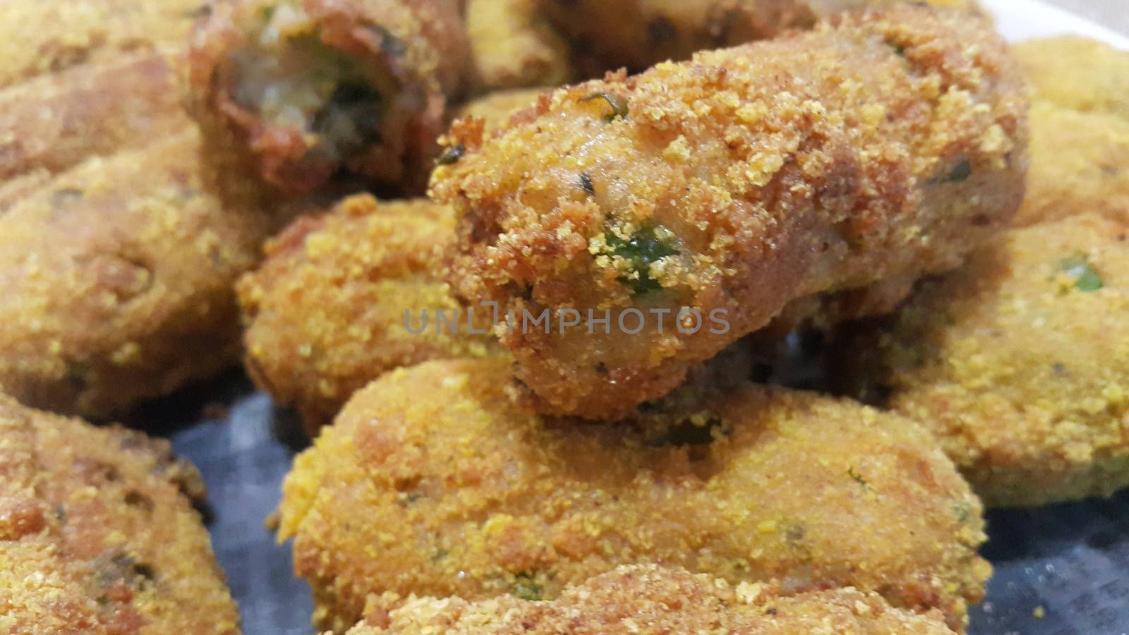 Spicy and delicious fried croquettes with a closeup perspective view by Photochowk