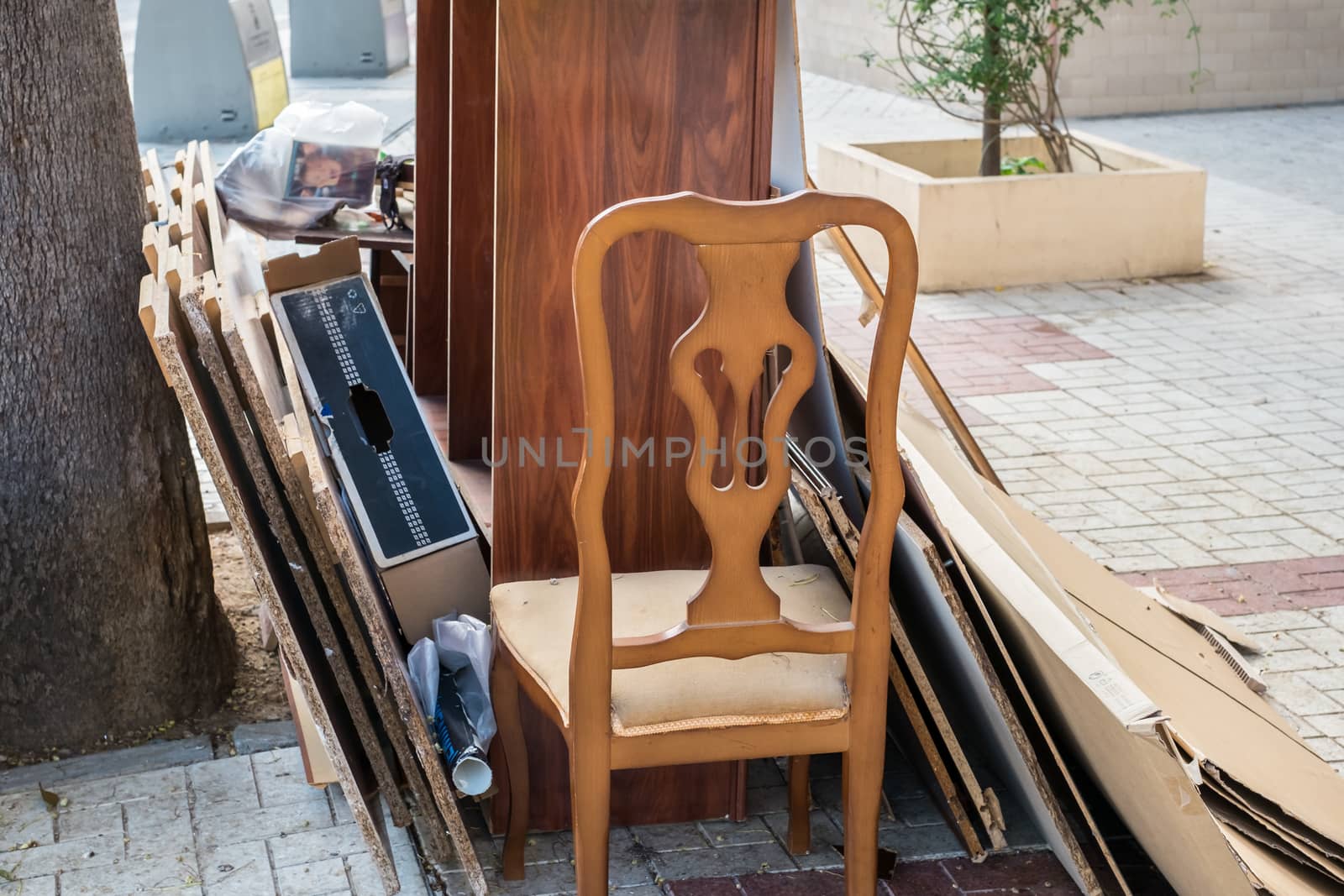 Malaga, Spain - May 20, 2018. Home furniture thrown in the the street in the city polluting the town and environment