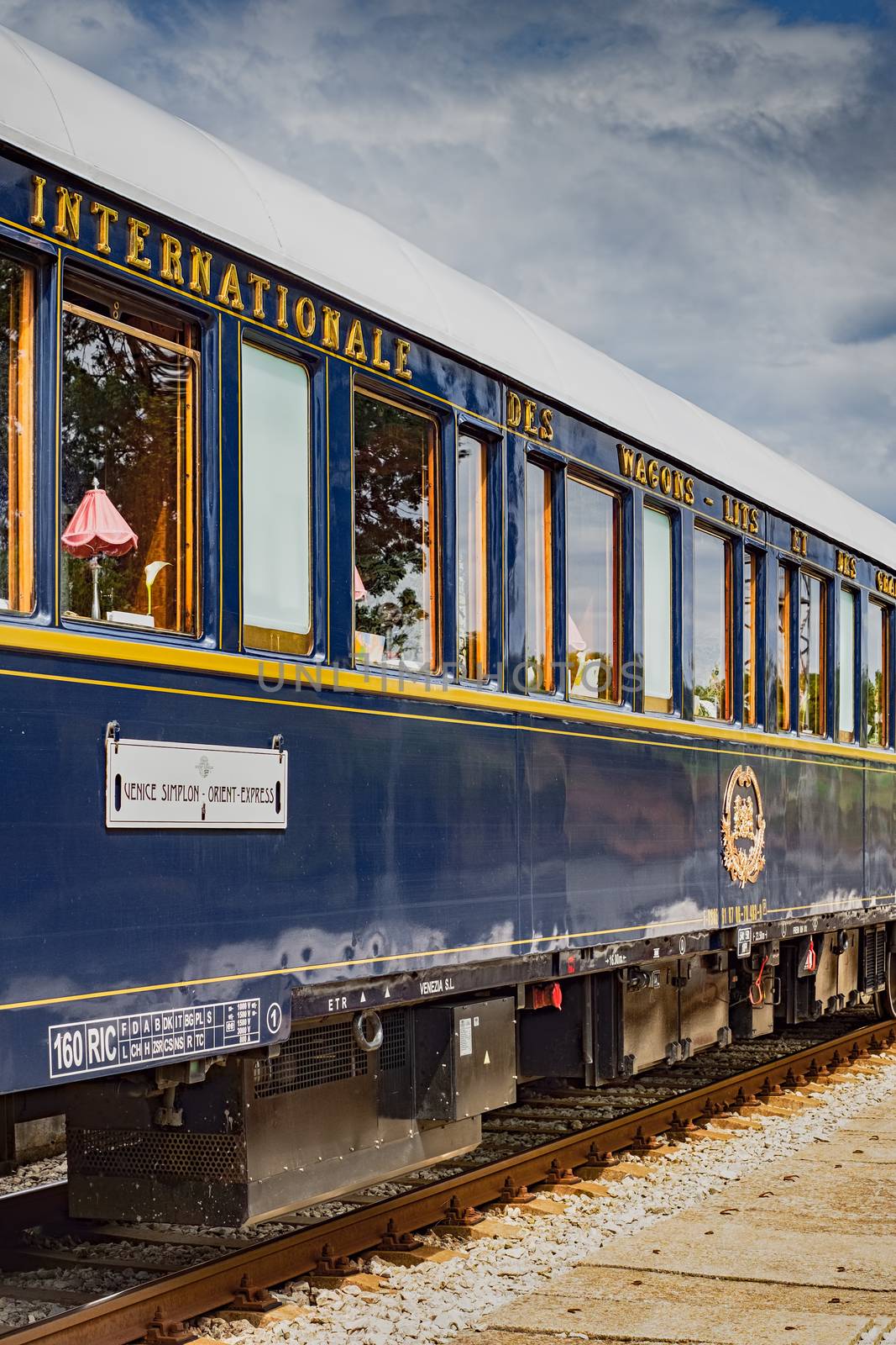 Ruse city, Bulgaria - August 29, 2017. The legendary Venice Simplon Orient Express is ready to depart from Ruse Railway station in a cloudy day. The luxury train travels between Paris and Istanbul.