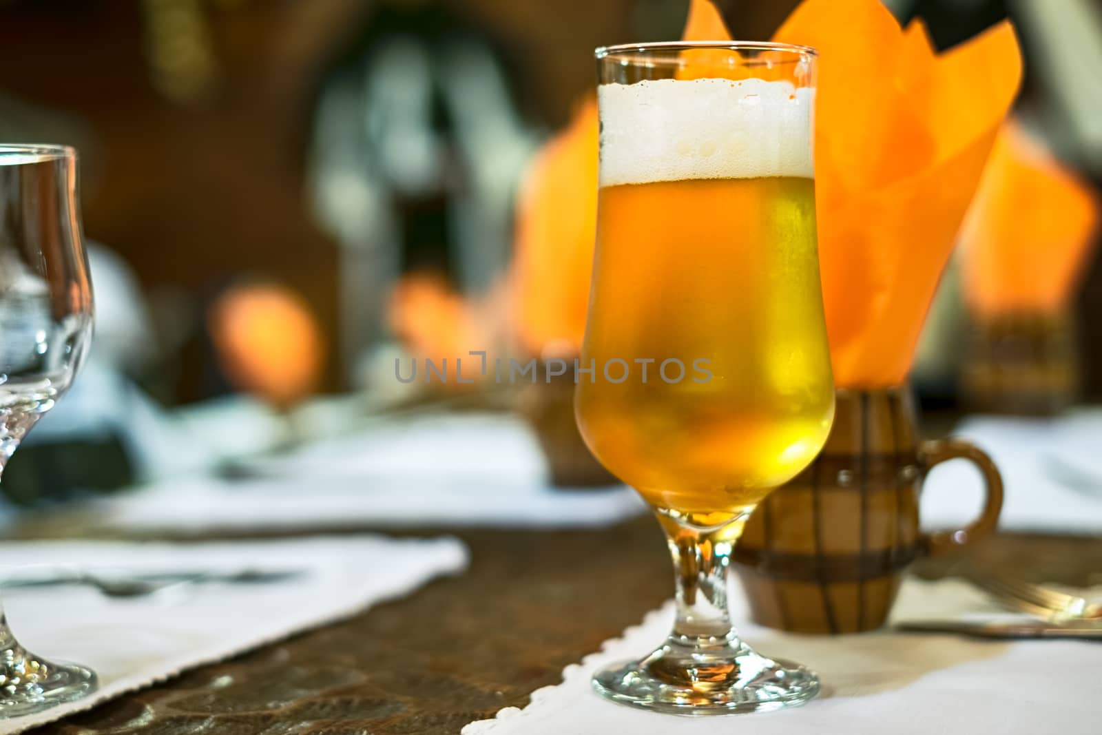 a glass of beer on the table at the restaurant