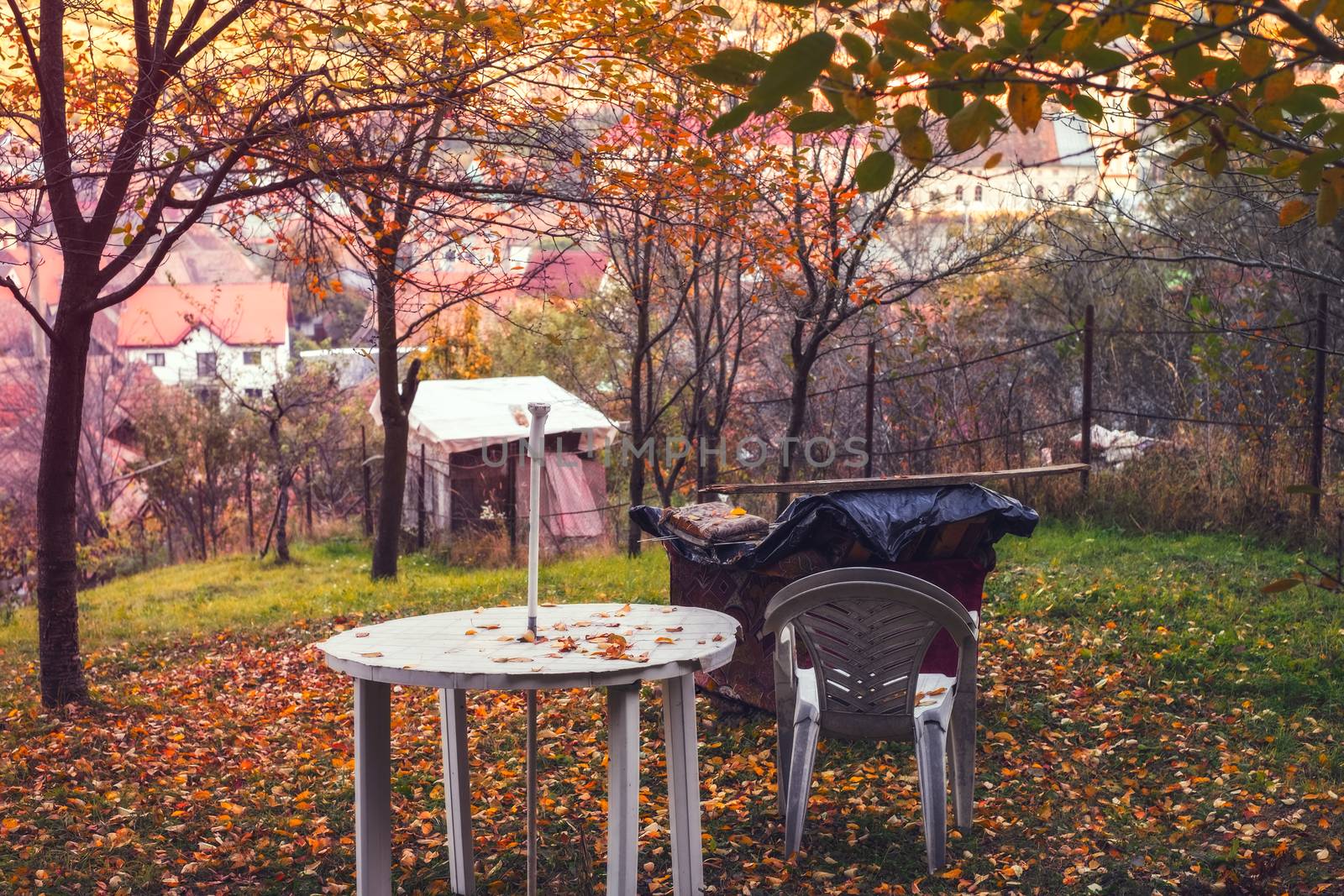 a plastic table and chairs in the garden