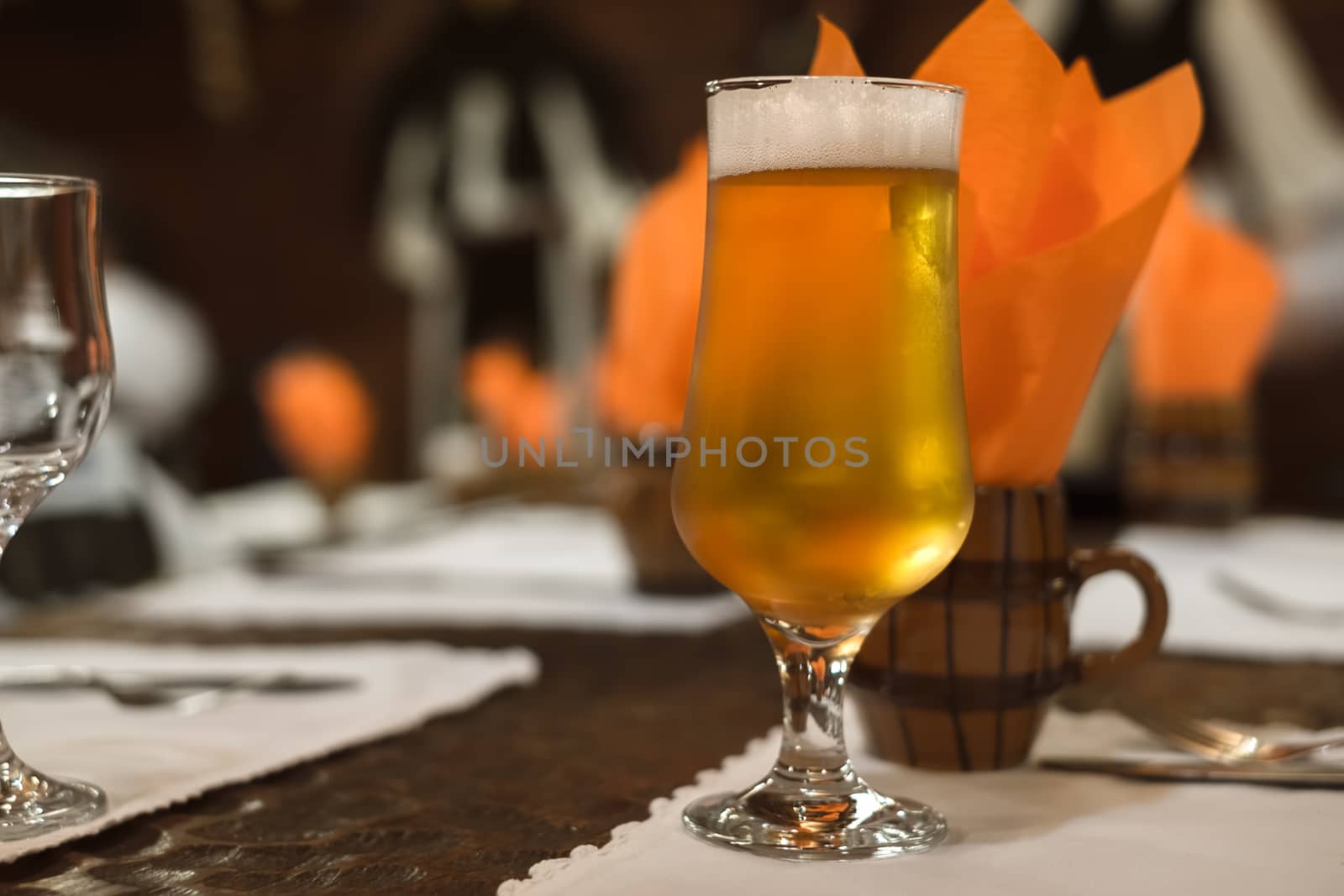 a glass of beer on the table at the restaurant