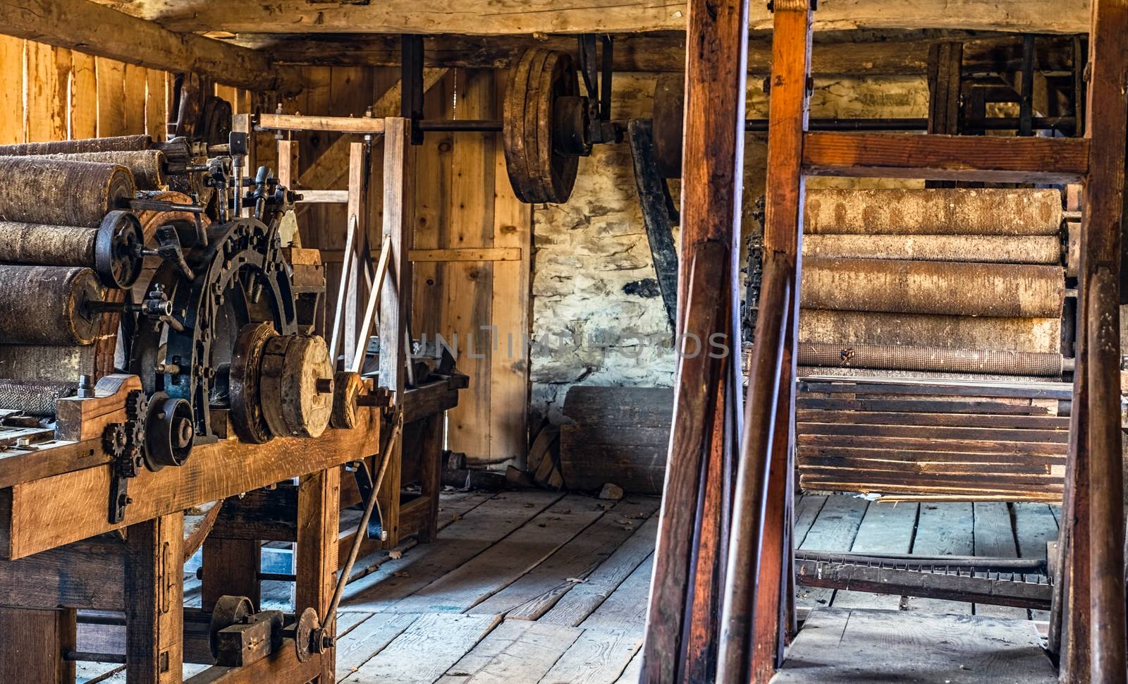ancient weaving loom in an interior of a wooden log hut