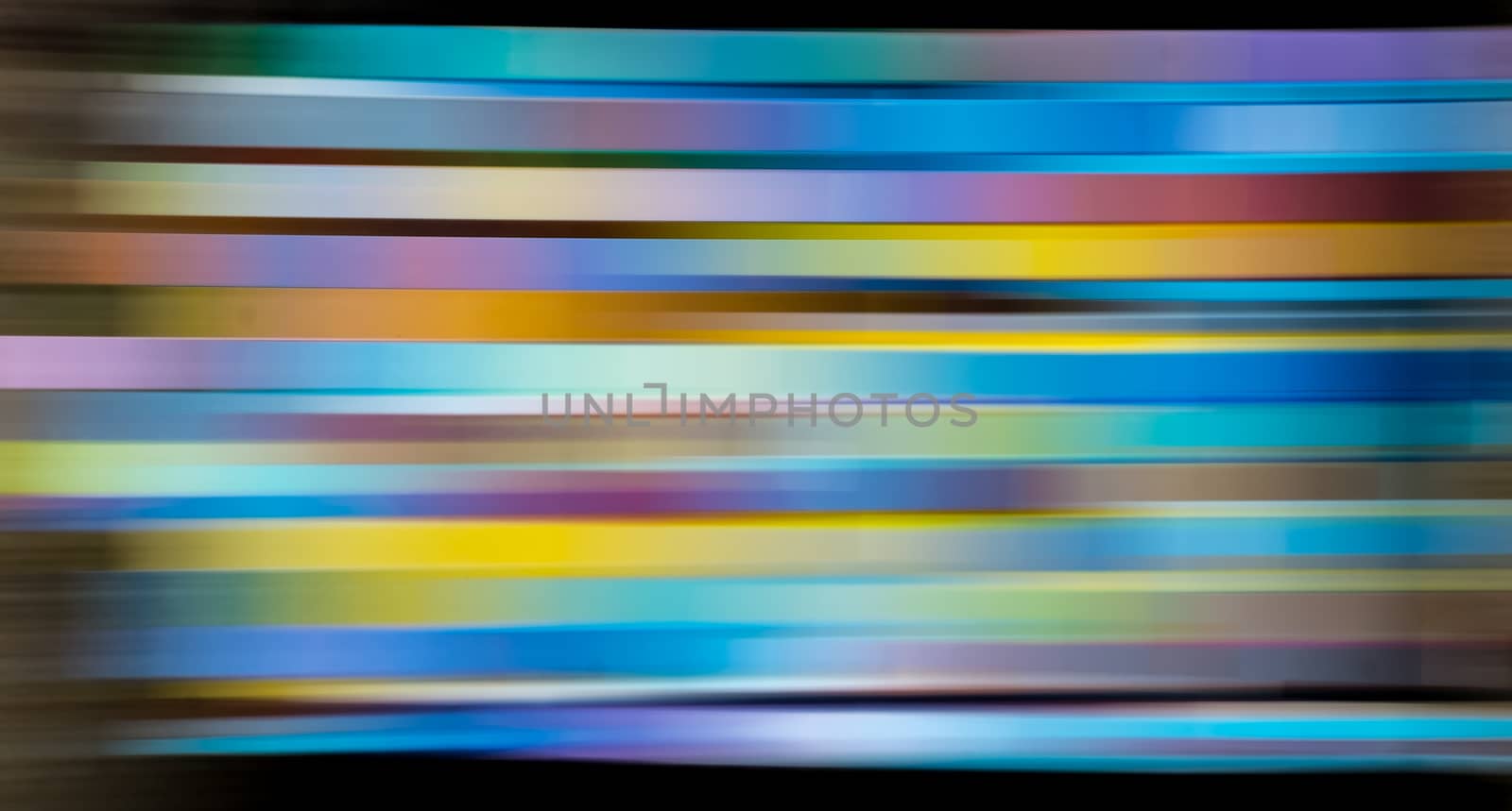 Abstract many-colored light trails, motion blur effect, real photo