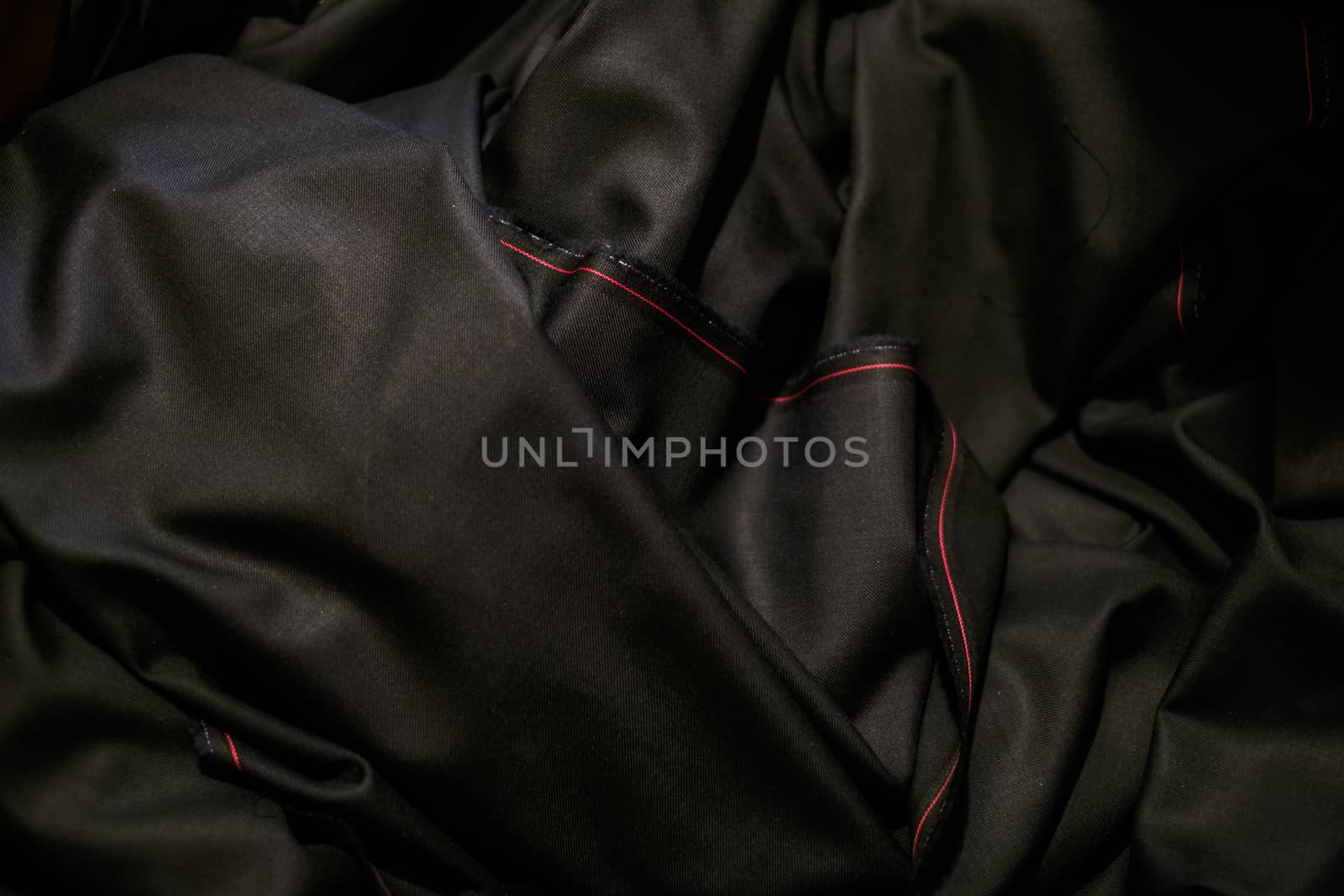 black cloth with a red stripe by Roberto