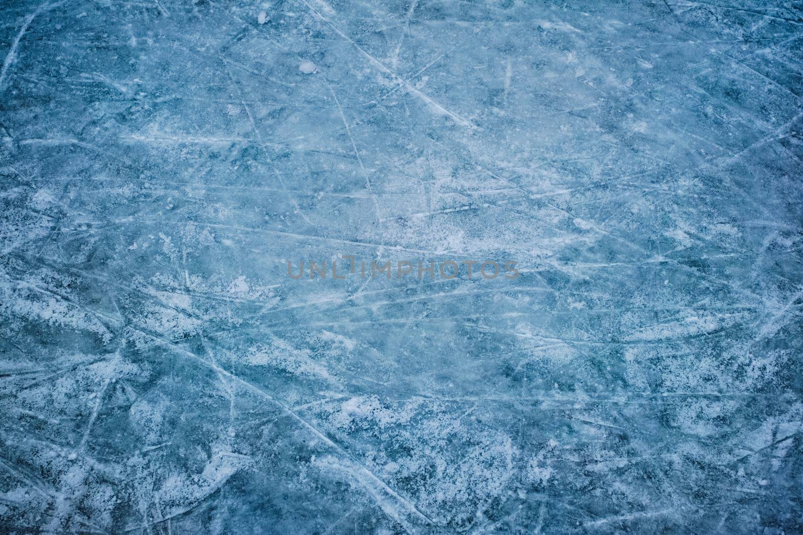 Blue ice in skate scratches, close view