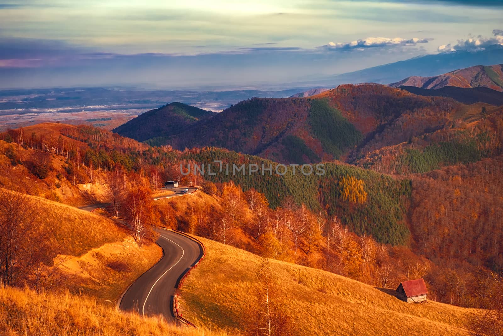 cars on the mountain road, Romanian Fagaras mountains in the back, Paltinis area, Sibiu county, Romania, 1400m.