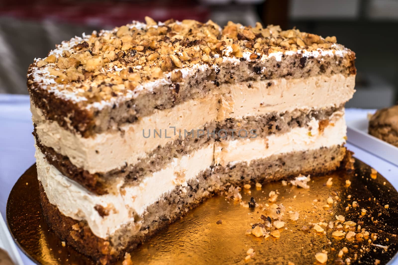 cake with nut on golden plate
