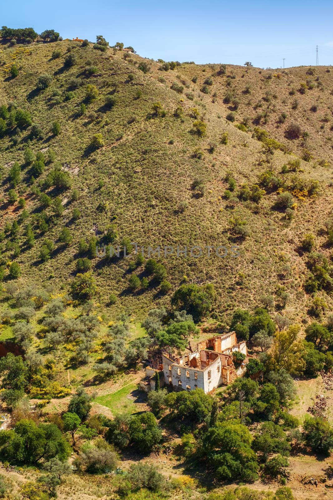 building in degradation at the foot of the hill