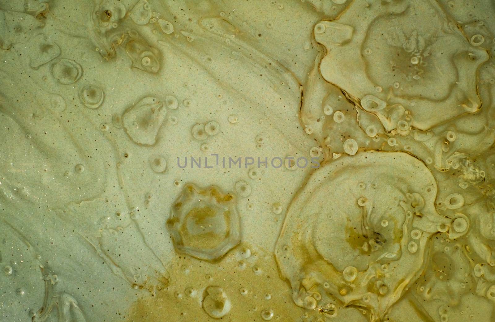 close up view of the prismatic mud volcano river with air bubbles, Buzau county, Romania.
