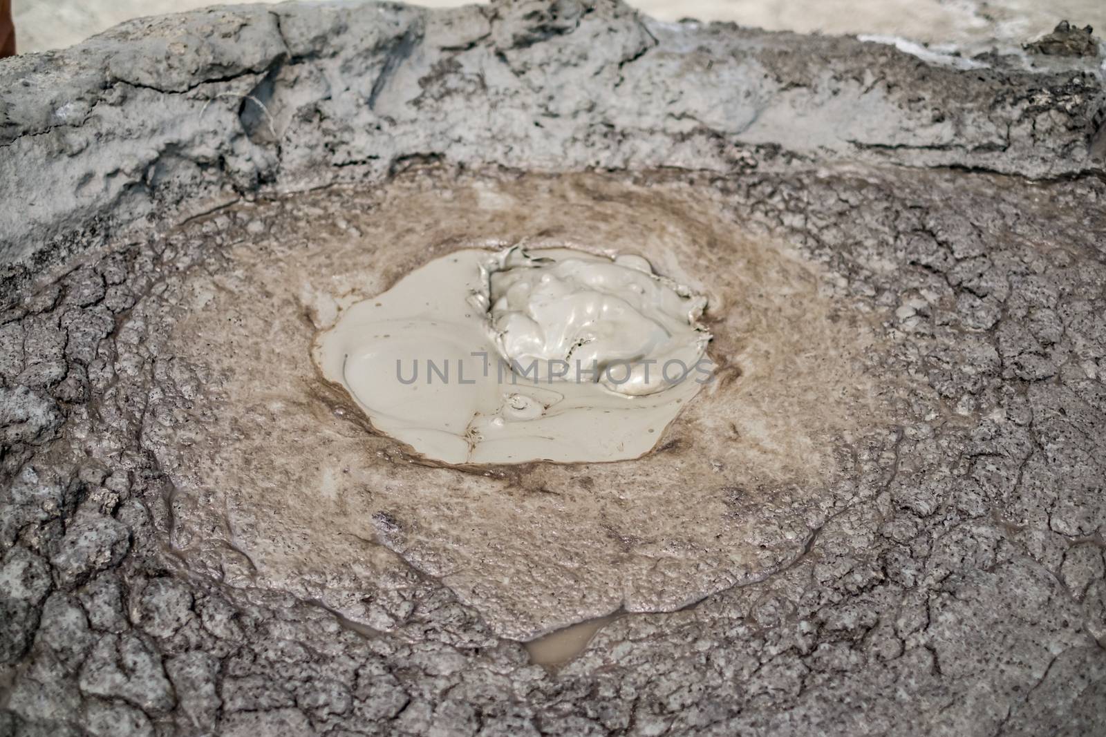 Close-up of bubbling mud in crater of mud volcano in Buzau county, Romania