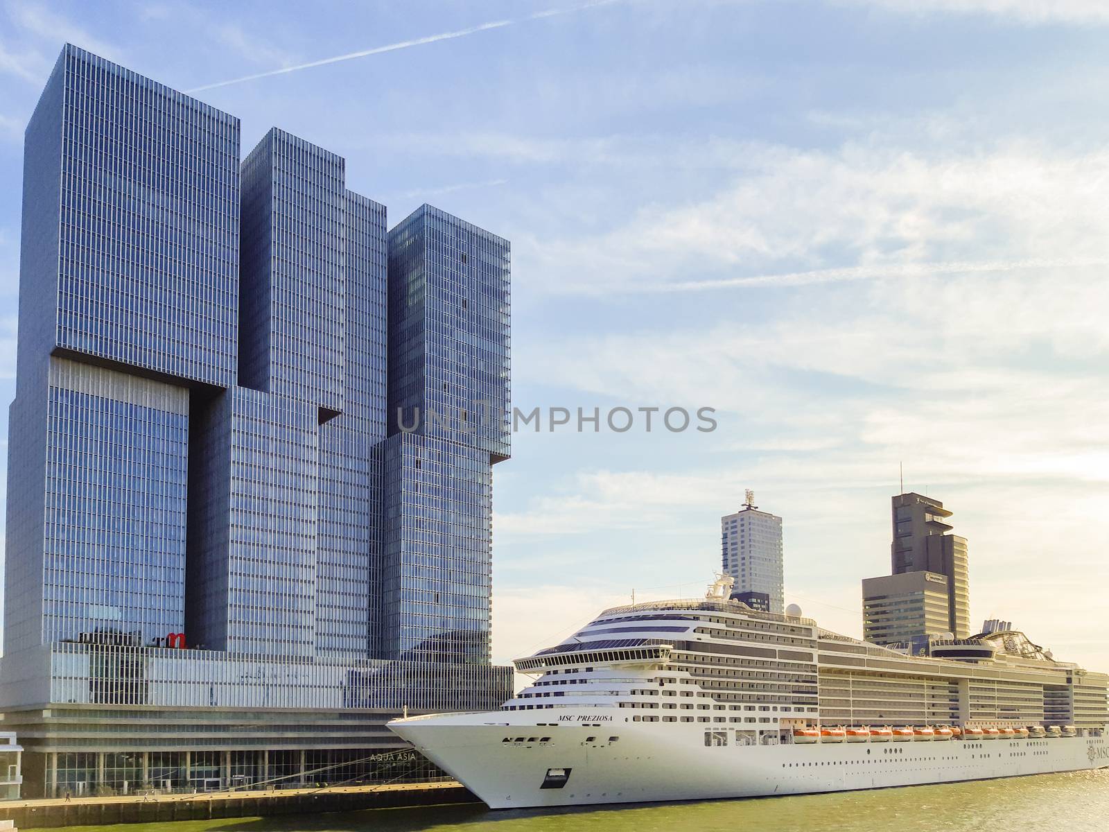 Cruise ship MSC Preziosa at Wilhelminapier with De Rotterdam business towers. Travel and toursim in Netherlands