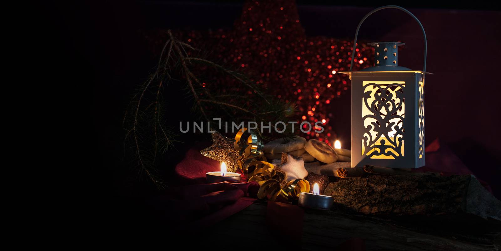 christmas backgrounds with low key lighting with candles and lantern