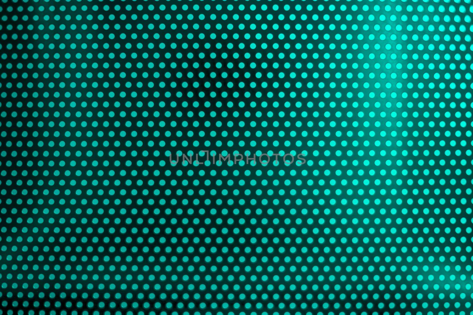 green light through perforated bent metal sheet