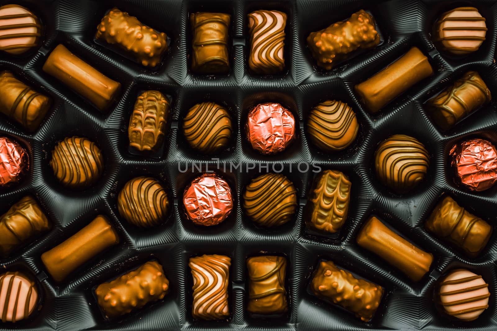Golden chocolate candies in the box, top view