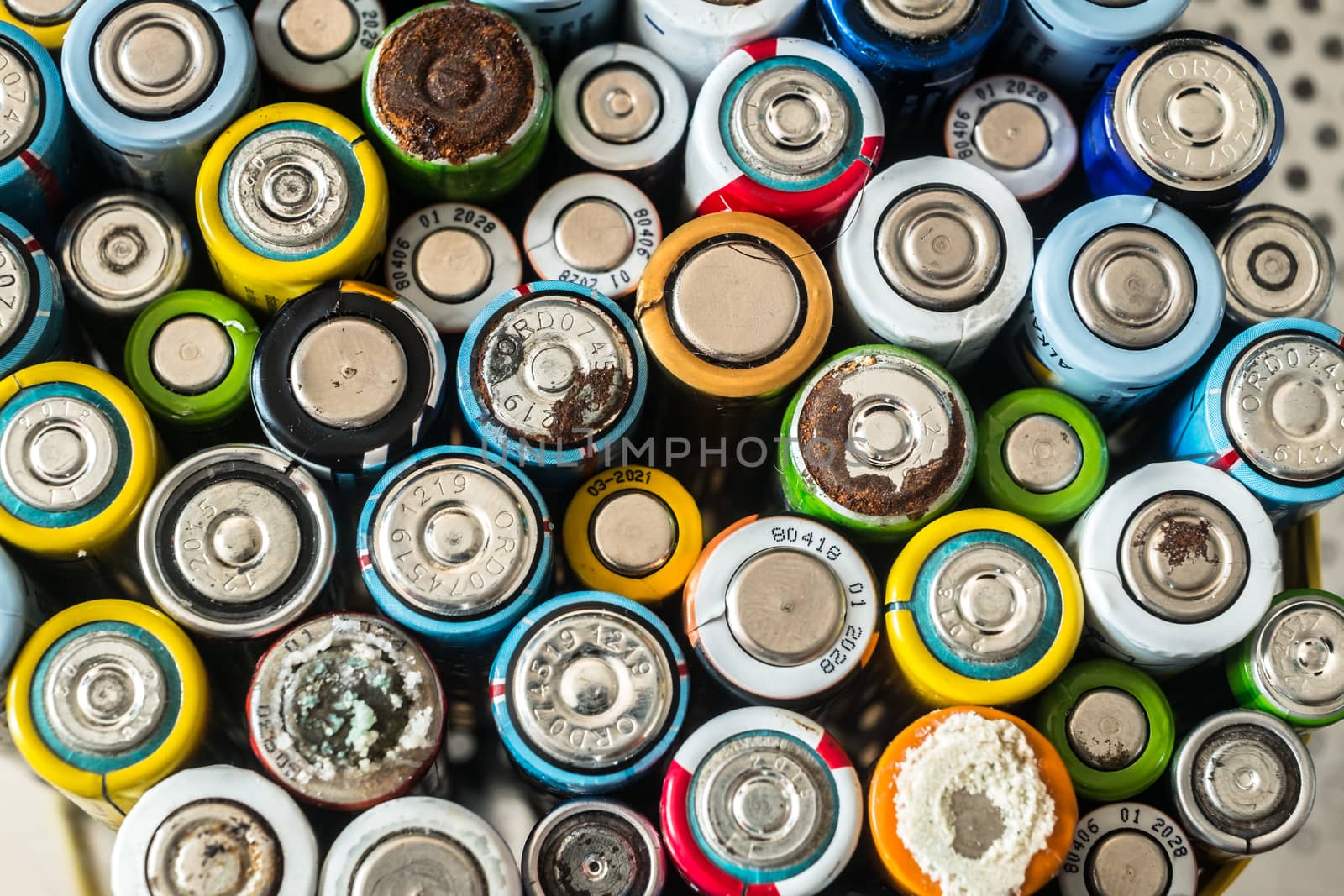 Group of used disposable drain batteries of various size by Roberto