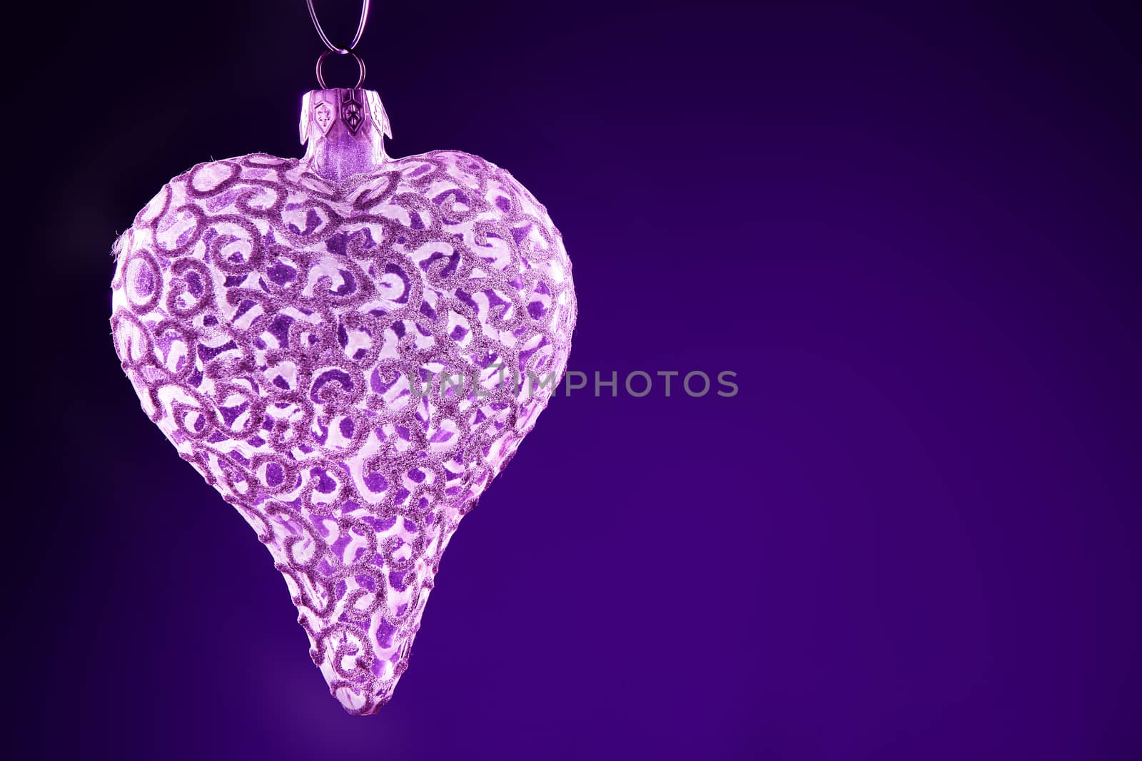 Purple Christmas background concepts with white hearts and wings with copy space