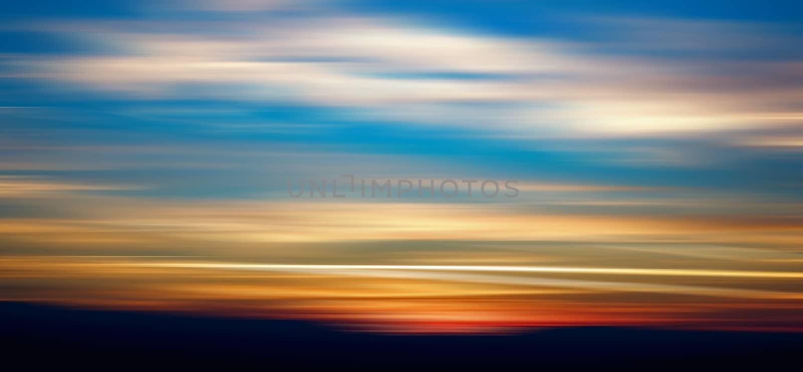 silhouettes of hills at sunset, motion blur effect