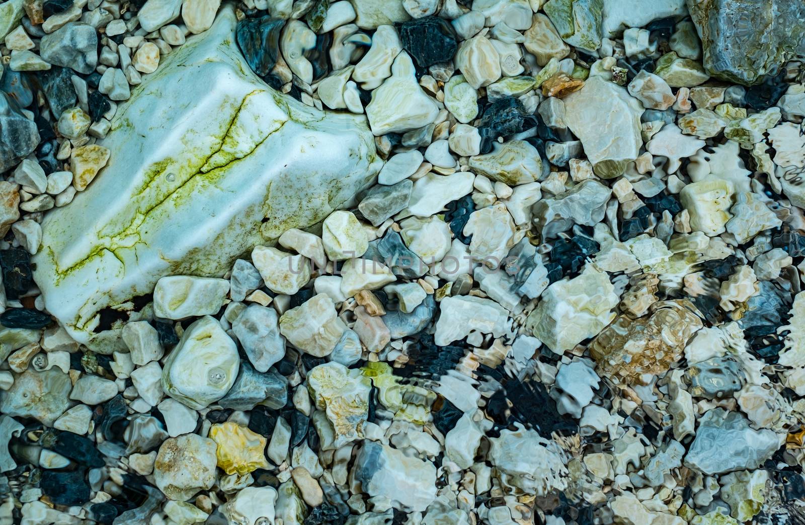 small stones under clear water