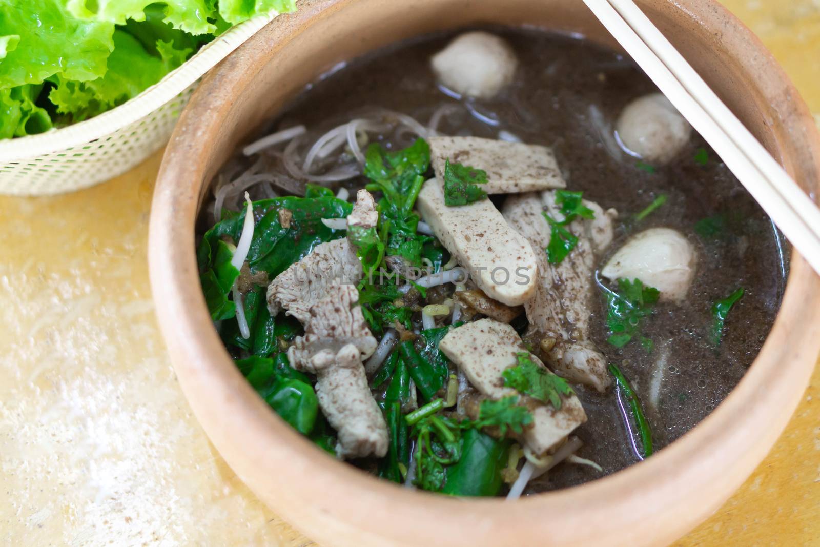 Rice noodle soup with Cooked Liver in  bowl on table, selective focus