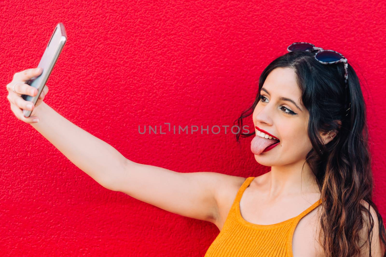 Portrait Of A Happy Young Woman Taking Selfie.