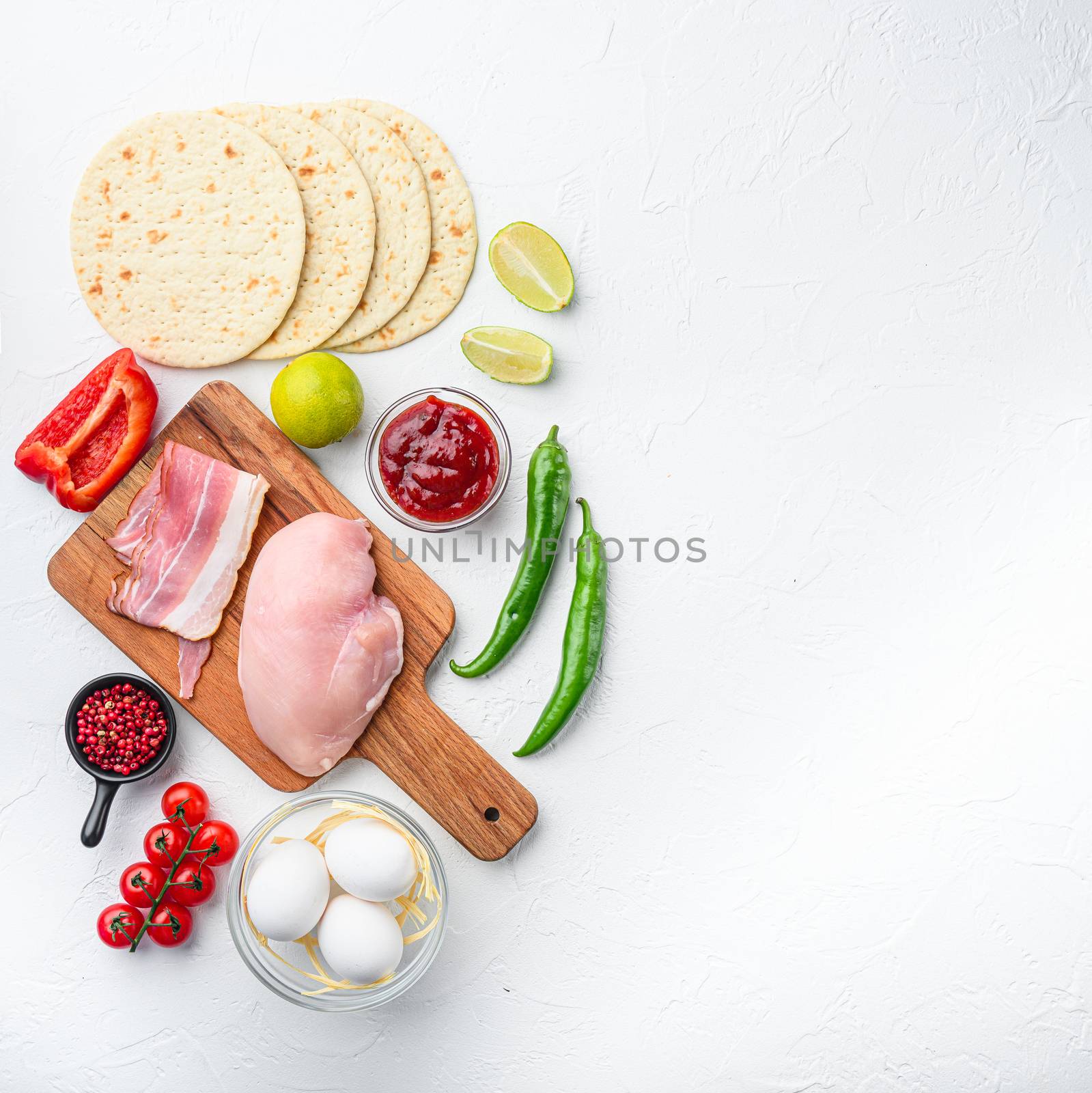Mexican tacos with vegetables and meat Ingredient for cooking over white textured background, top view with space for text