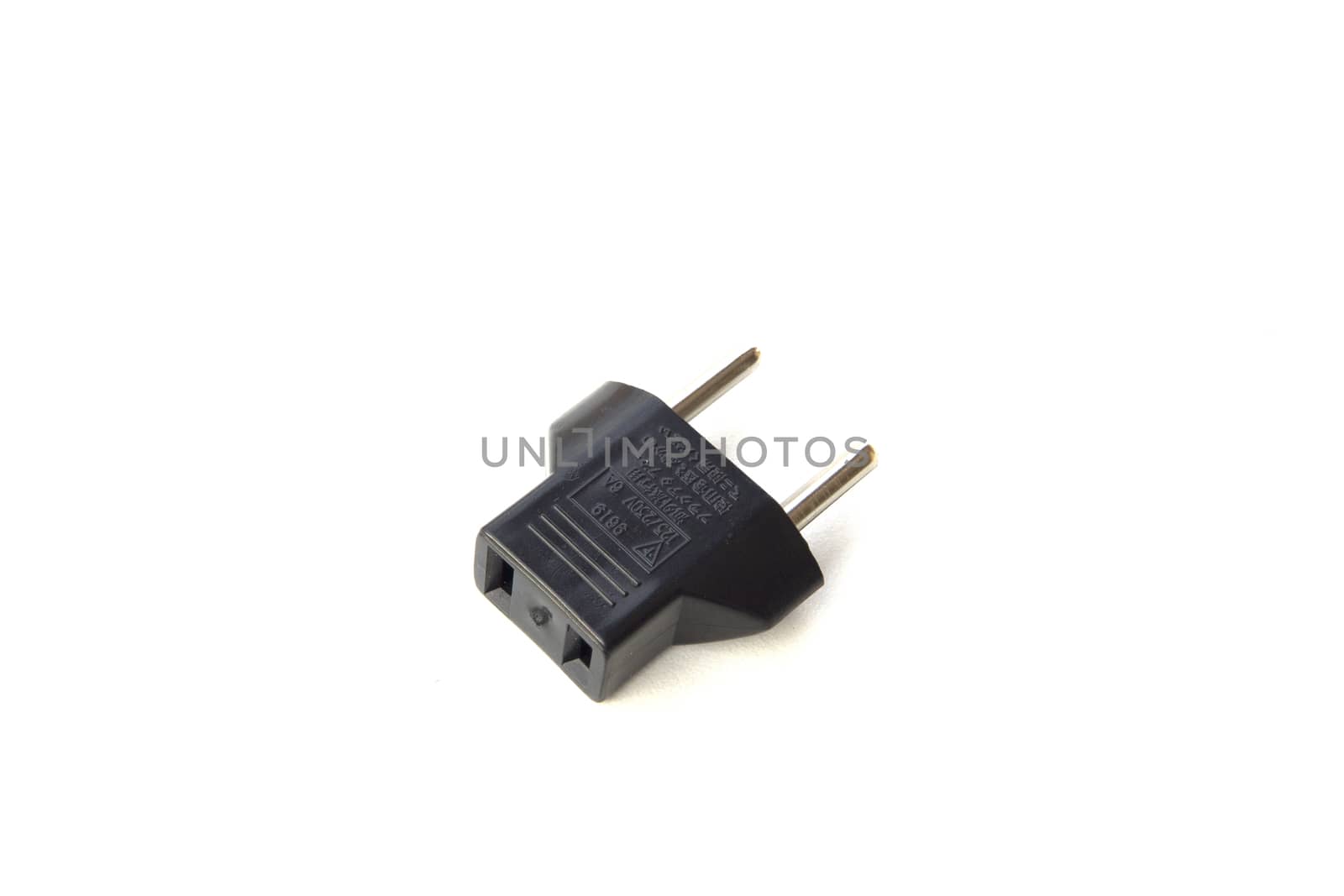 Black plug adapter on white background. by sonandonures