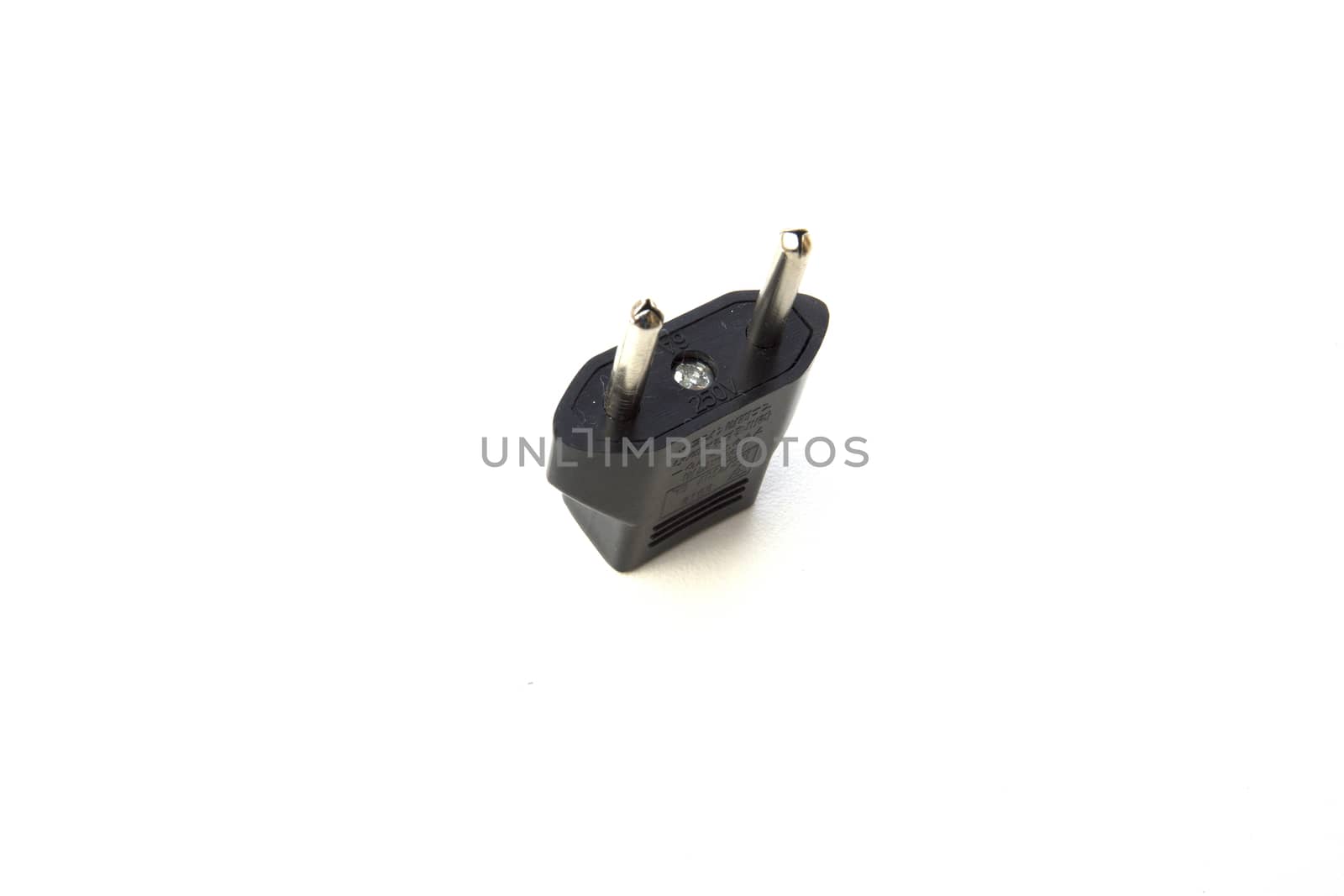 Black plug adapter on white background. by sonandonures