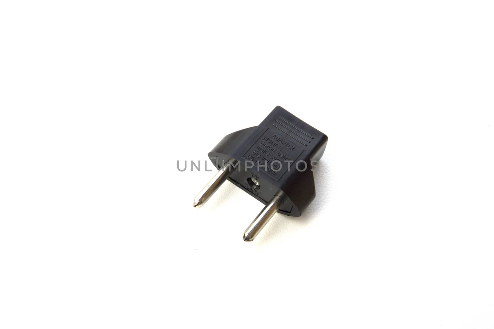 Black plug adapter on white background. by sonandonures