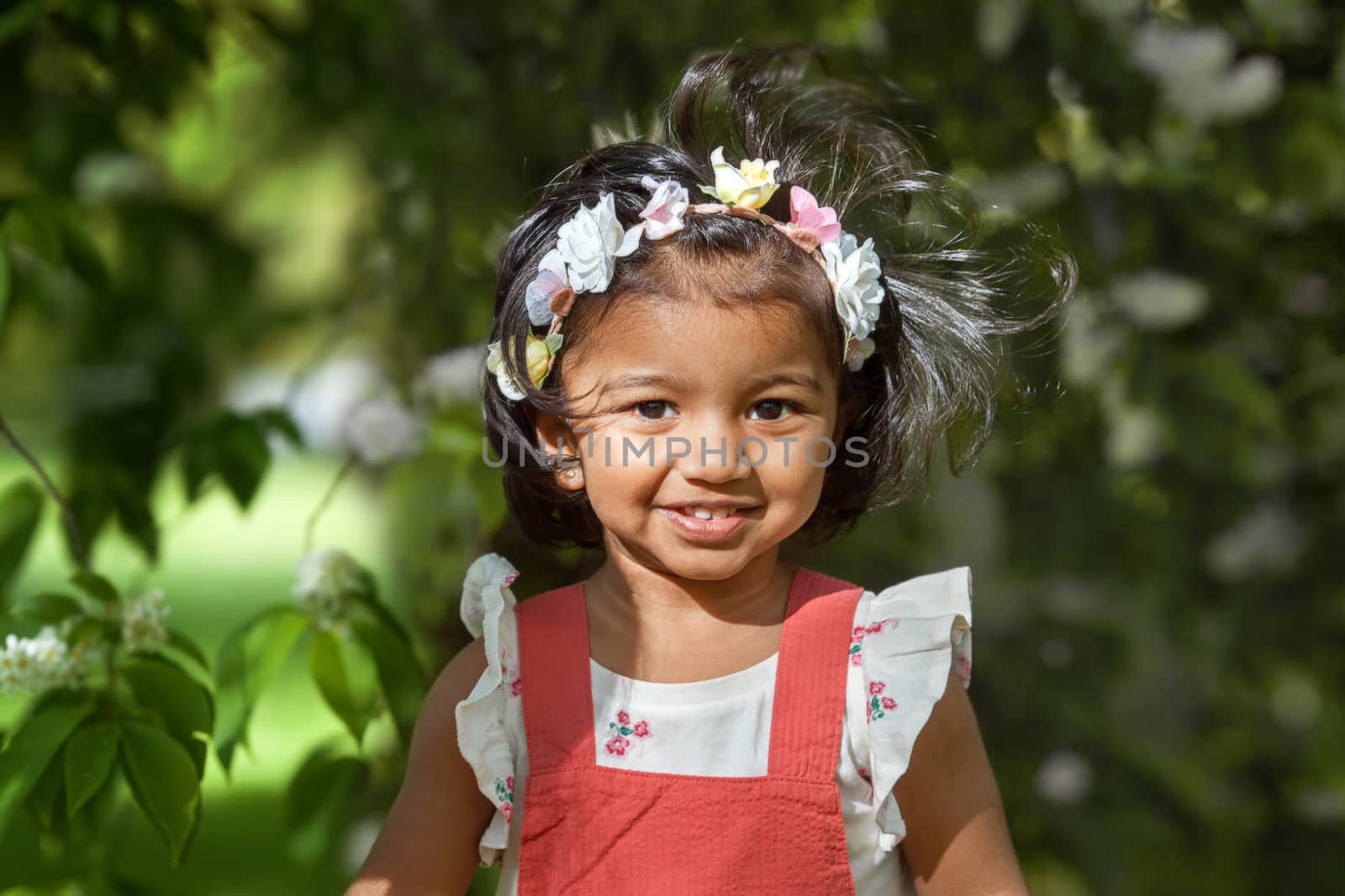 happy little girl in a summer Park